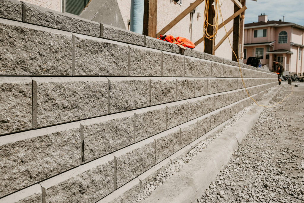 A retaining wall in progress on an Earth and Turf Landscaping Edmonton job site.