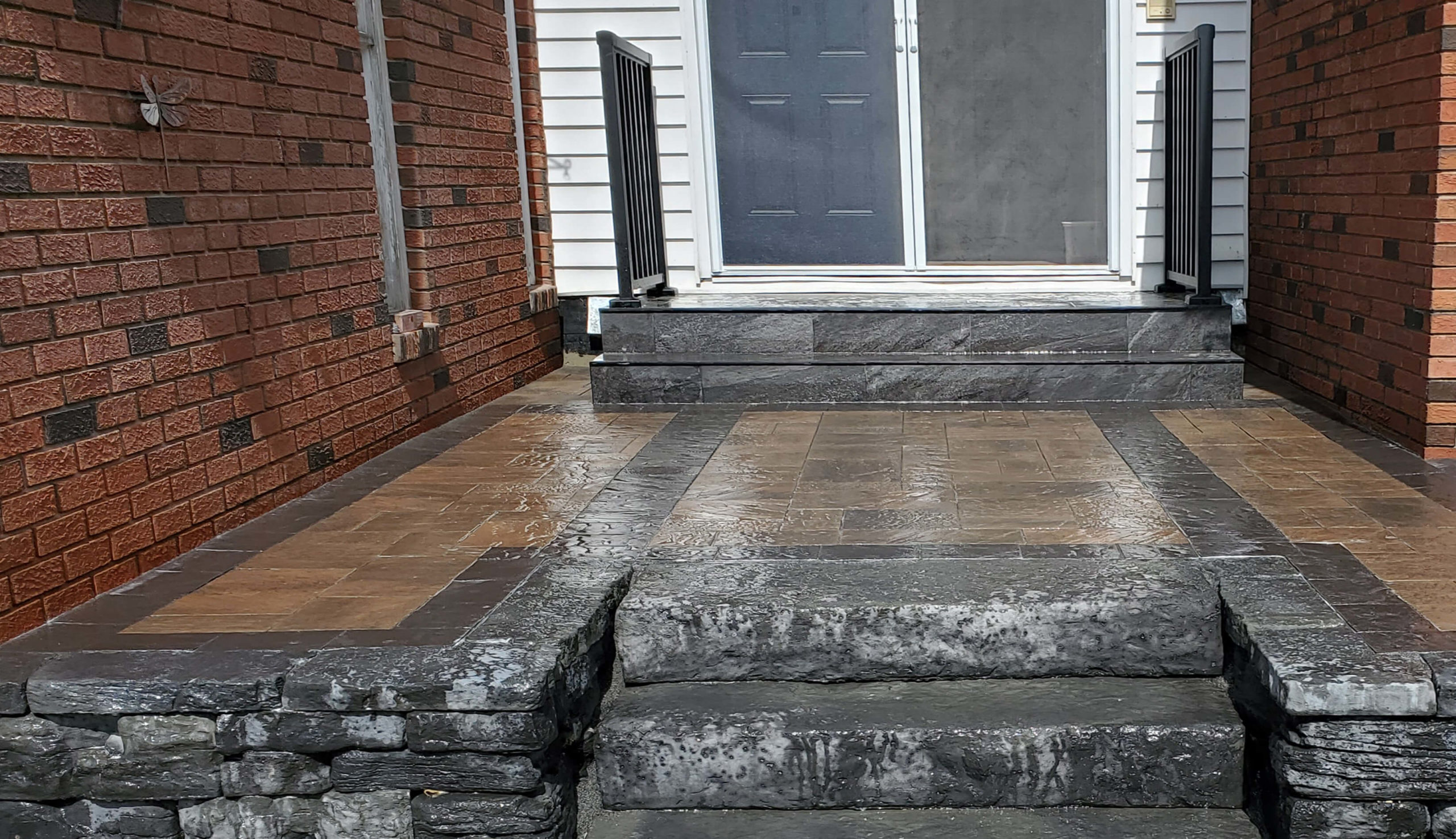 A new stone patio, installed by earth and turf landscaping.