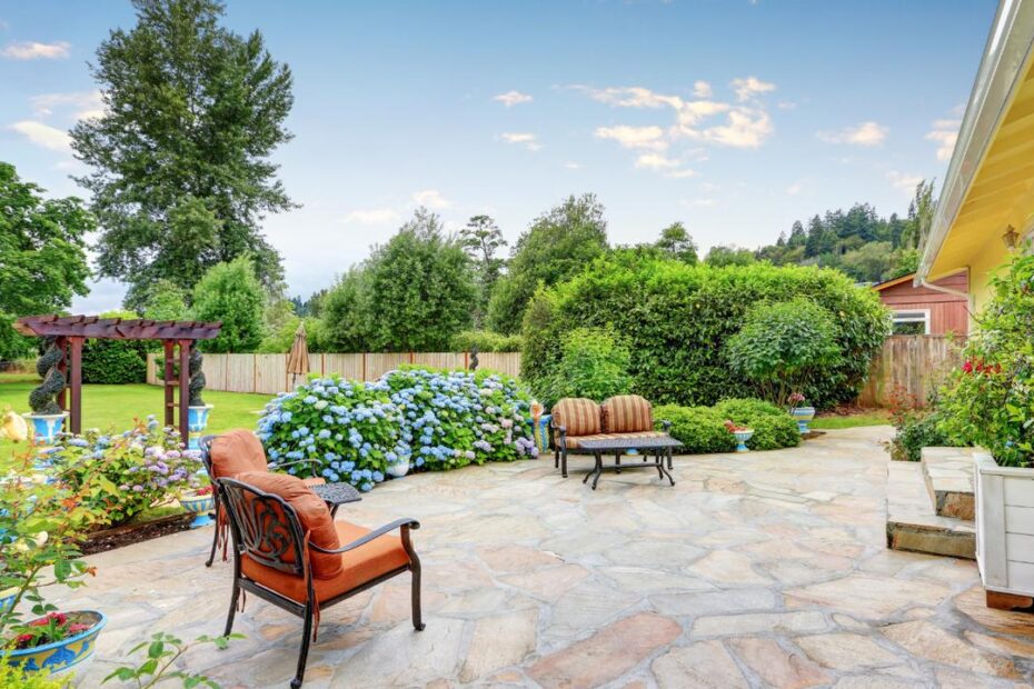 Fancy outdoor brick patio set in backyard.