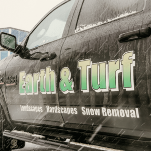 Side of Earth and Turf snow removal truck